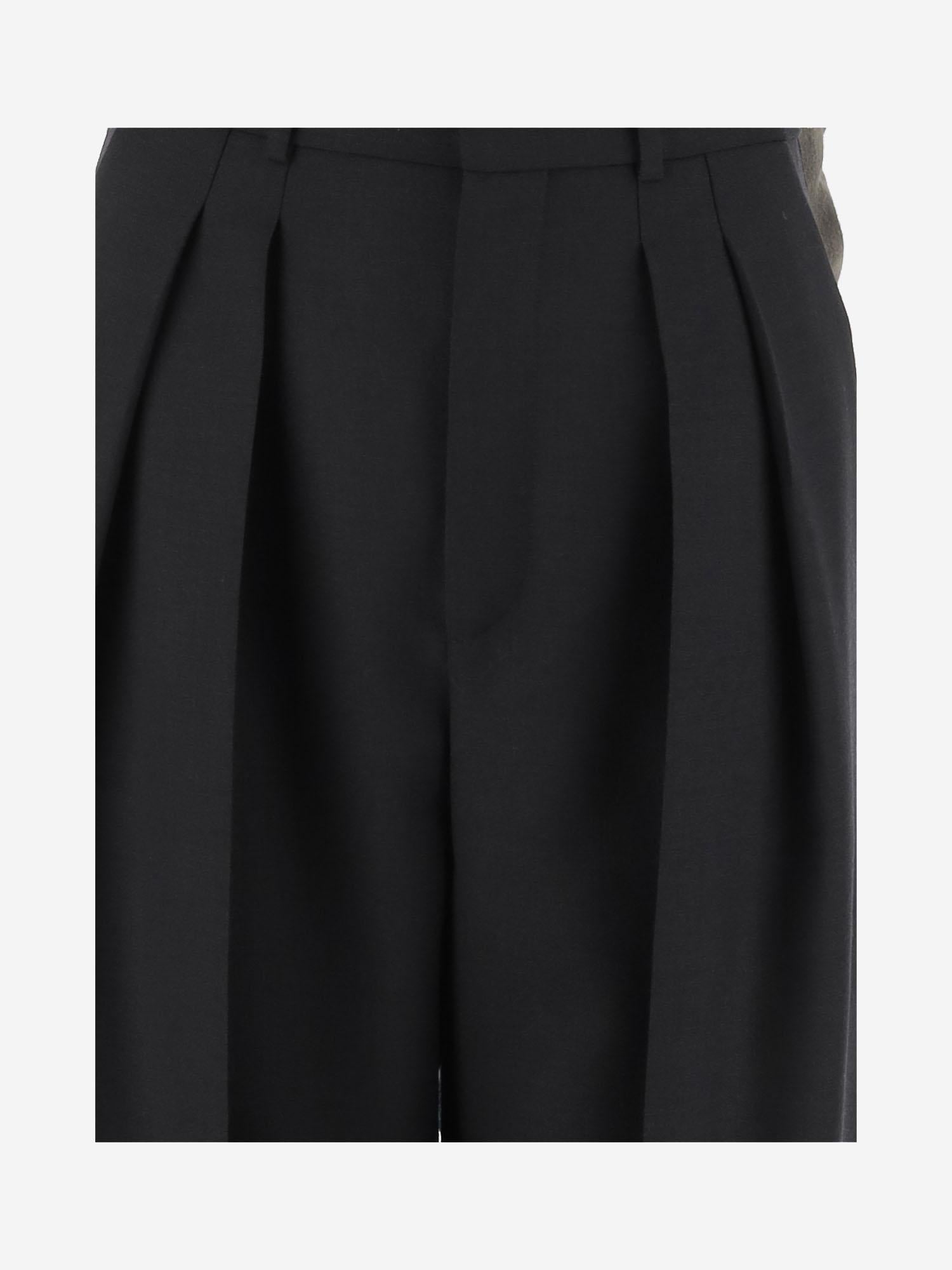 Pantaloni sartoriali a vita alta e gamba ampia in lana 834634 Y5K321000 SAINT LAURENT