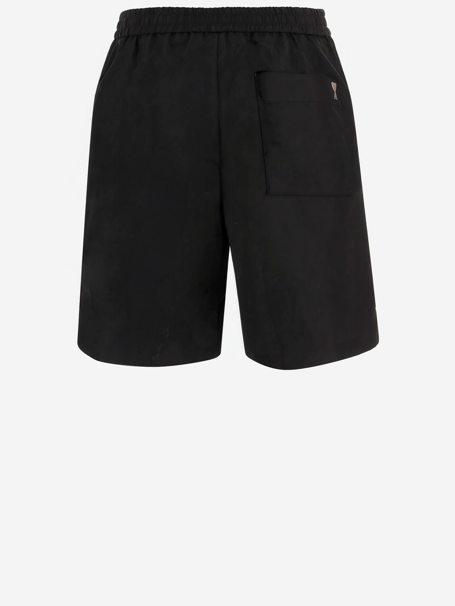 PANTALONI CORTI IN NYLON HSO833PA0037 001 AMI 