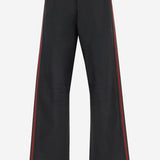 Pantaloni in denim di cotone stretch spalmato con nastro web A006GG XDDH31000 GUCCI 