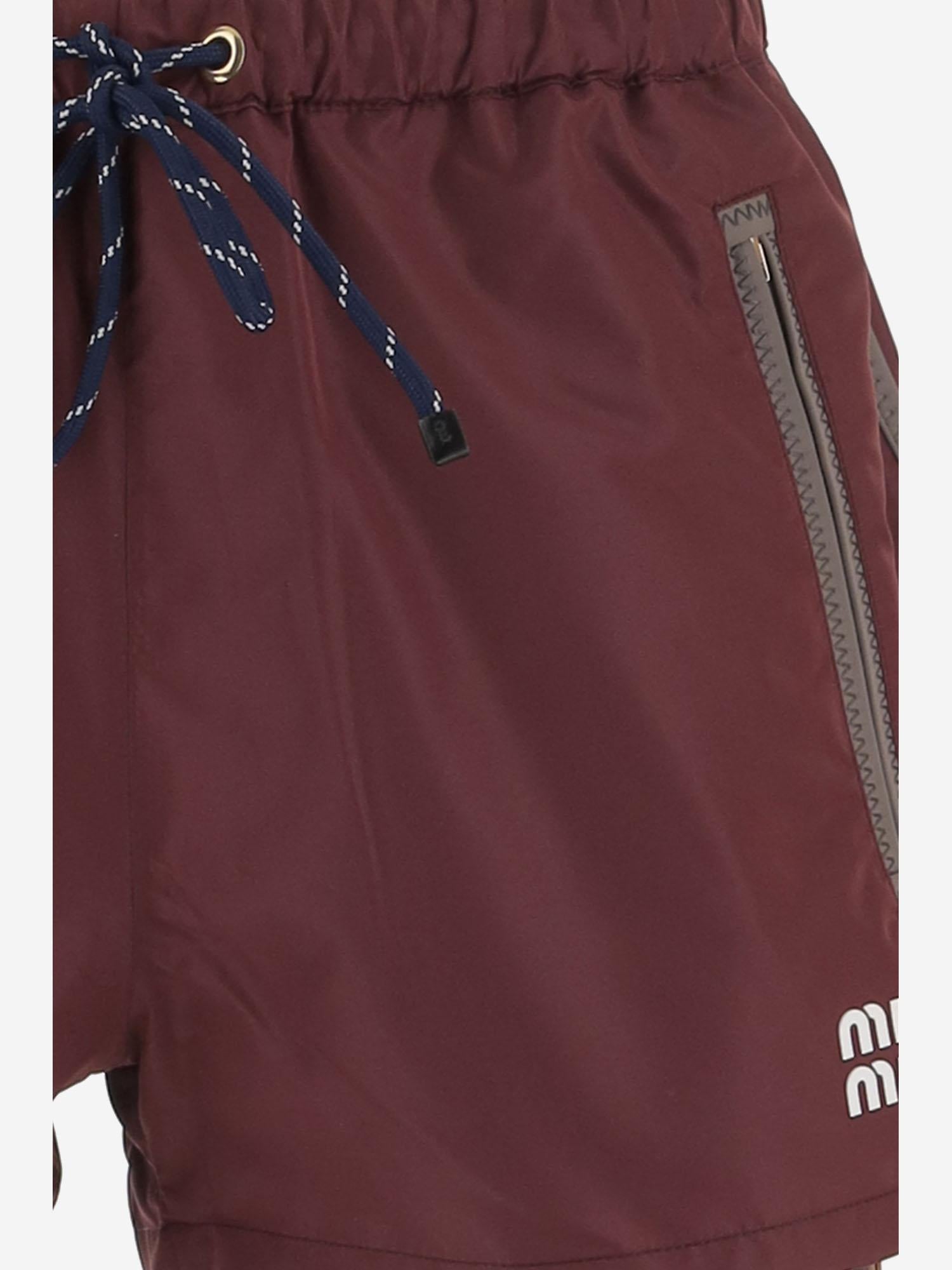 SHORTS IN NYLON CON LOGO MP1809 121IF0399 MIU MIU 