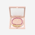 BRACCIALE IN TESSUTO E METALLO BUBBLELETTERSGOLDPLATED SMILE SORBET ISLAND 
