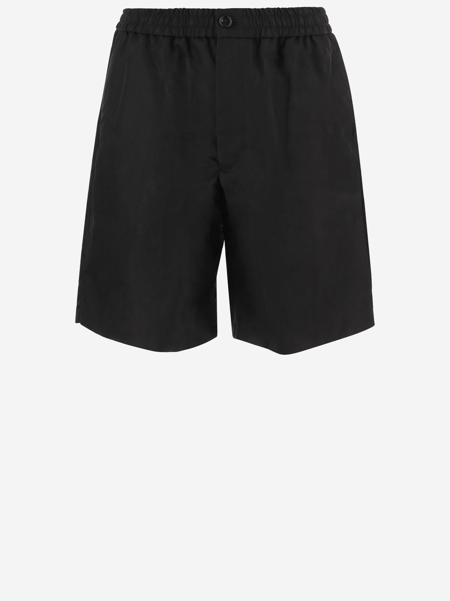 PANTALONI CORTI IN NYLON HSO833PA0037 001 AMI 