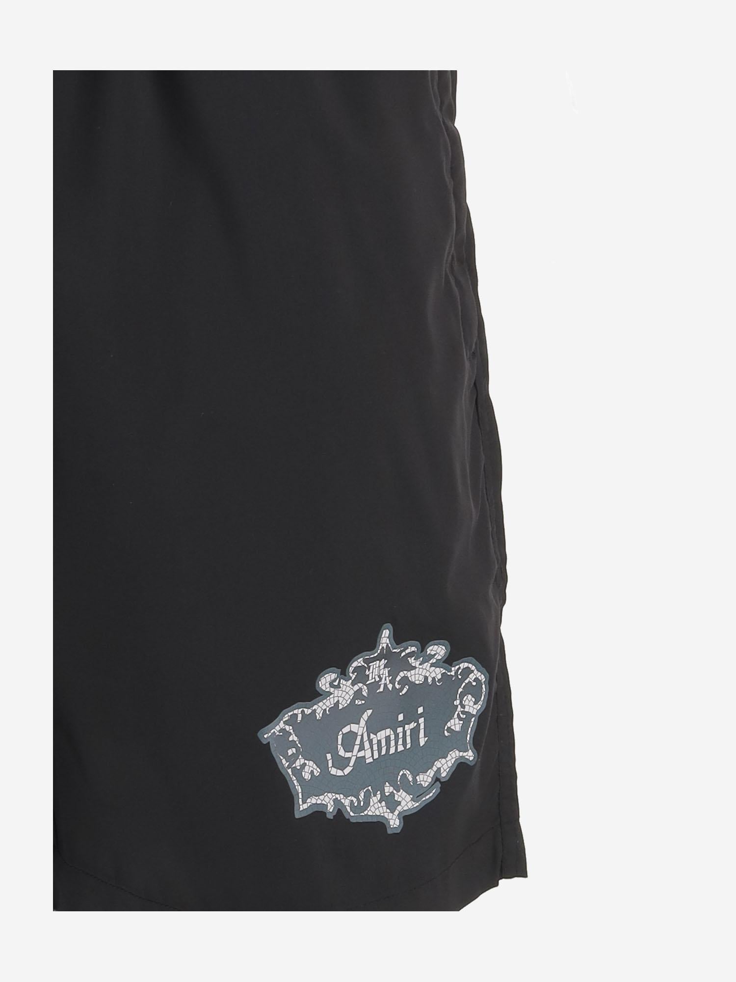 SHORTS DA BAGNO IN TESSUTO TECNICO AMBOSW 1008001 AMIRI 