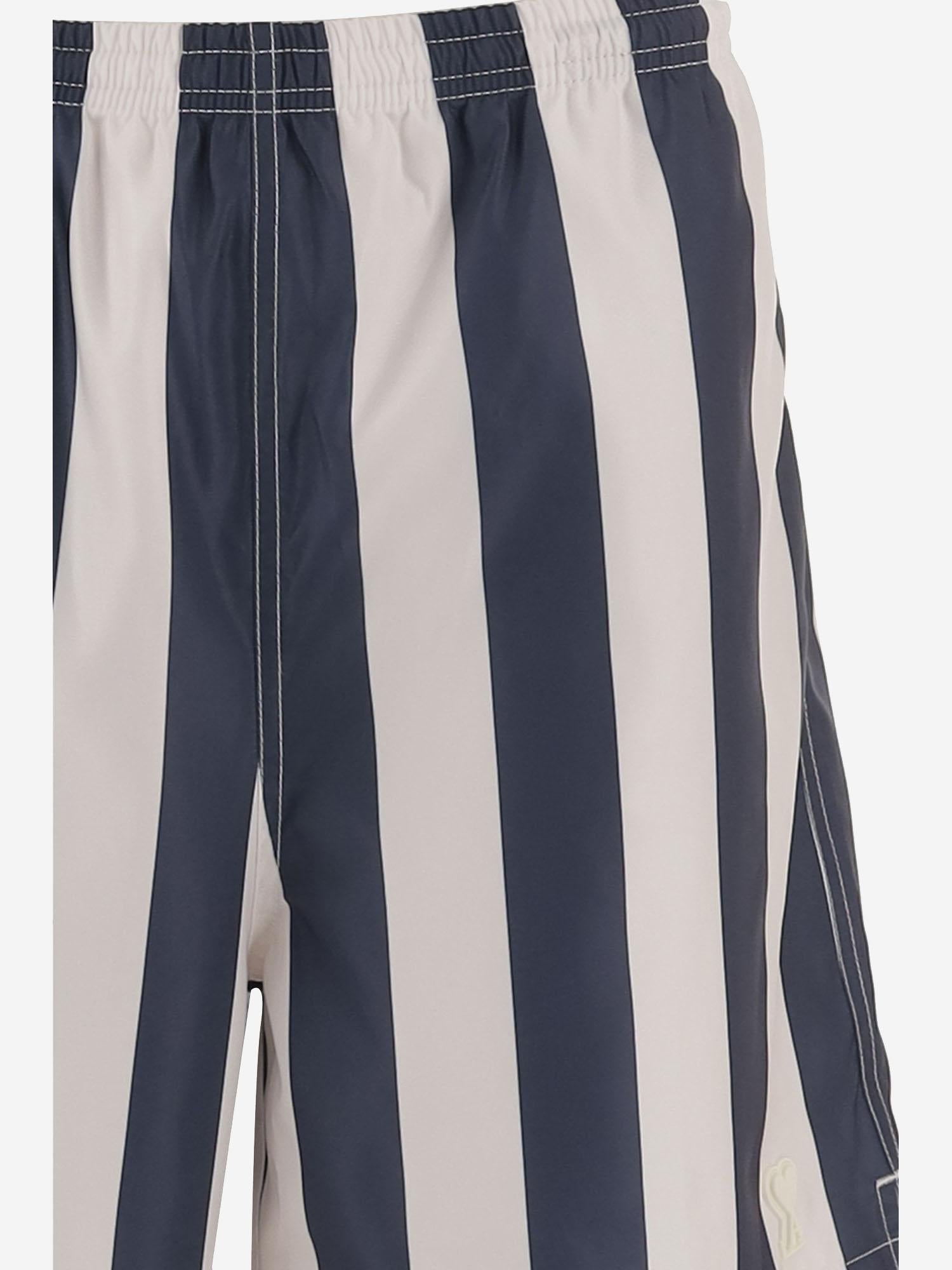 SHORTS DA BAGNO LUNGHI A RIGHE HBW316AW0027 A027 AMI 