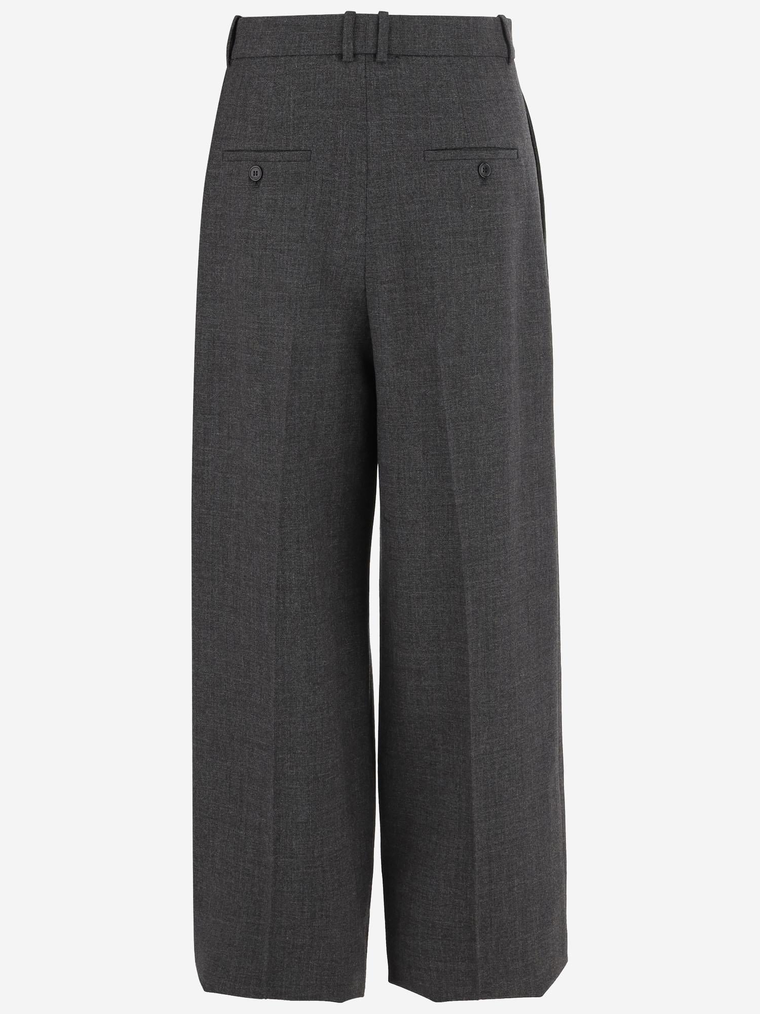 Pantaloni sartoriali a vita alta e gamba ampia in lana 824389 Y5K321473 SAINT LAURENT 