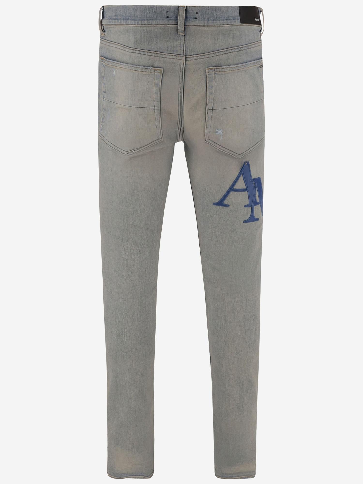JEANS IN COTONE STRETCH CON LOGO AMDNSY 1114AntiqueIndigoBlue AMIRI 