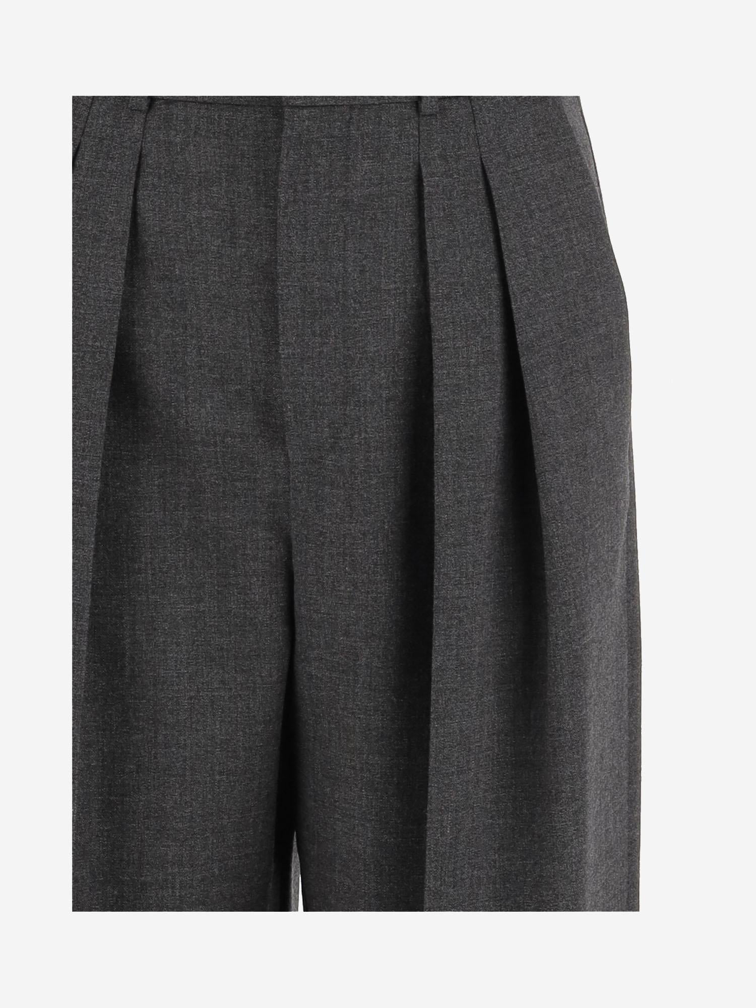 Pantaloni sartoriali a vita alta e gamba ampia in lana 824389 Y5K321473 SAINT LAURENT 