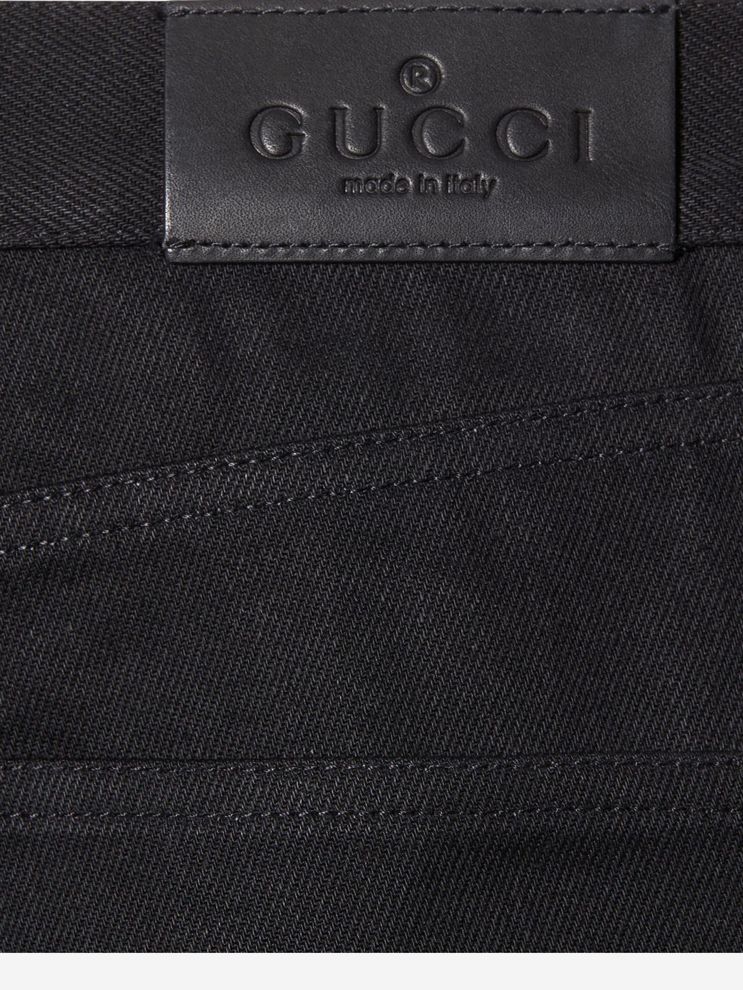 Jeans in denim di cotone con dettaglio morsetto 860844 XDDFZ1000 GUCCI 