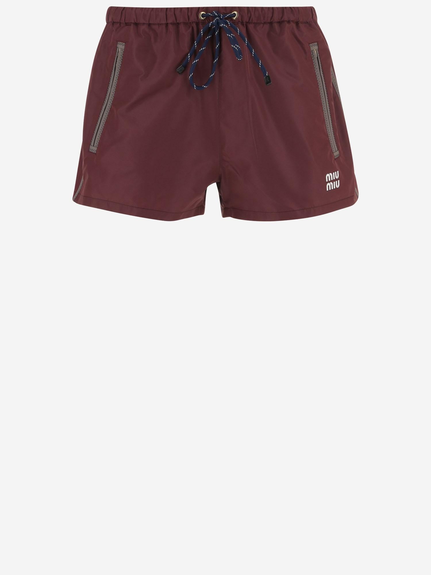 SHORTS IN NYLON CON LOGO MP1809 121IF0399 MIU MIU 