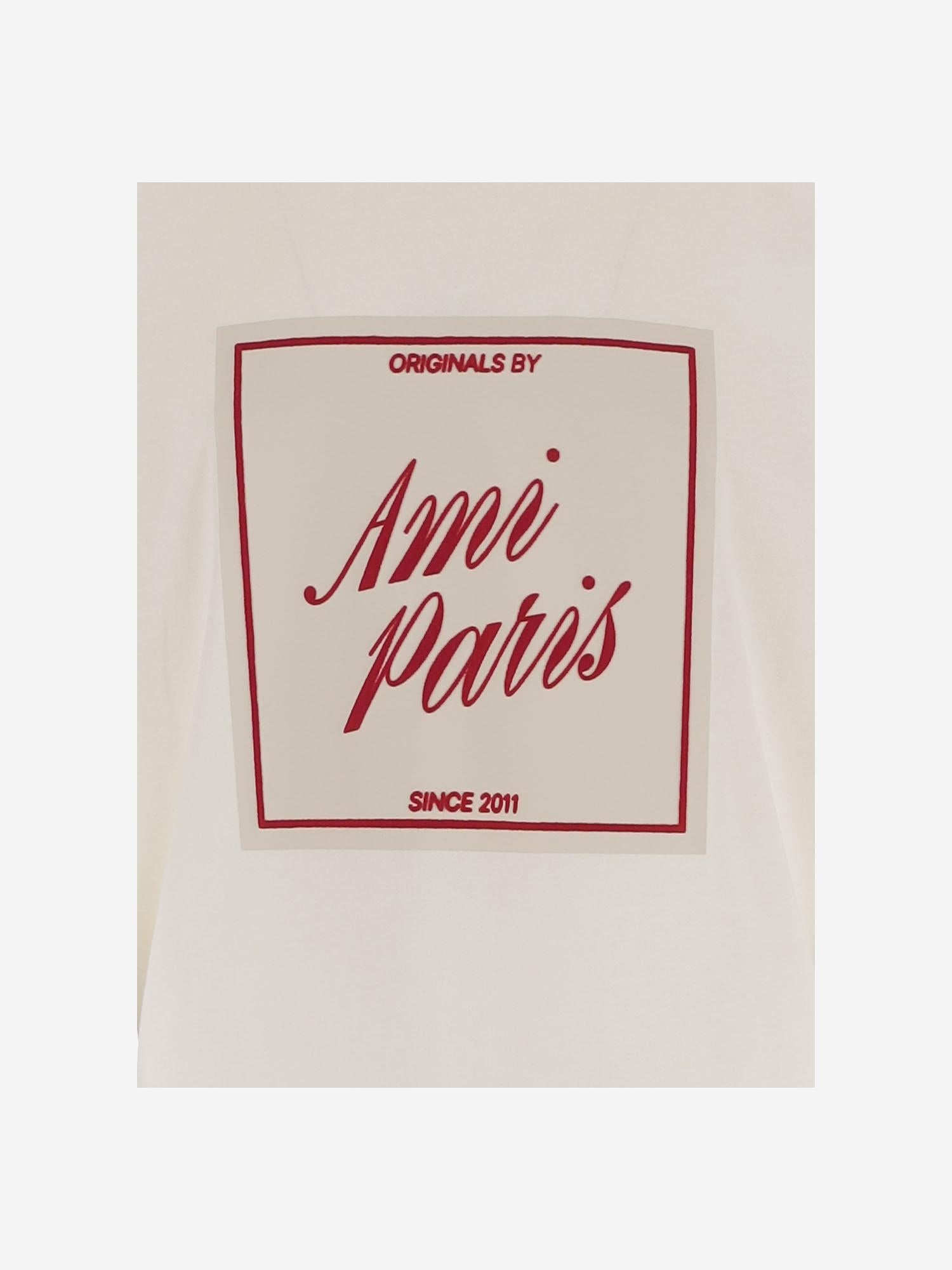 T-SHIRT IN COTONE CON STAMPA AMI PARIS HERITAGE UTS385726 136 AMI 
